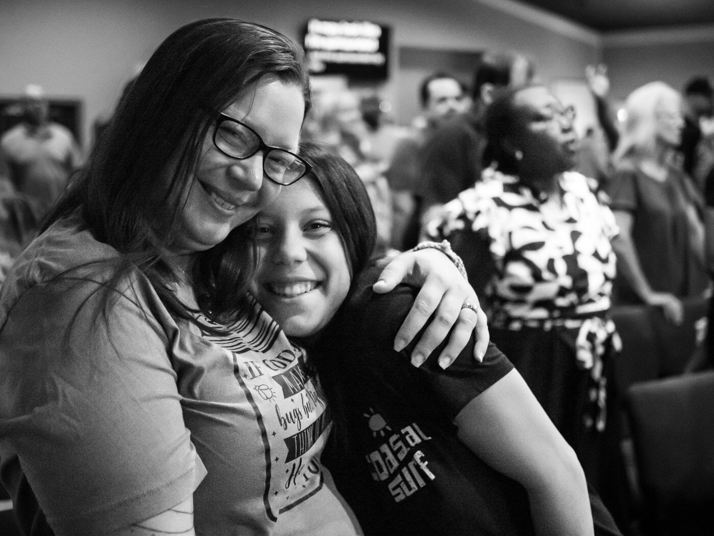 Mother and daughter embracing at Overflow Worship Center